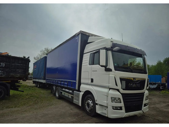 Φορτηγό μουσαμάς MAN TGX 26.460