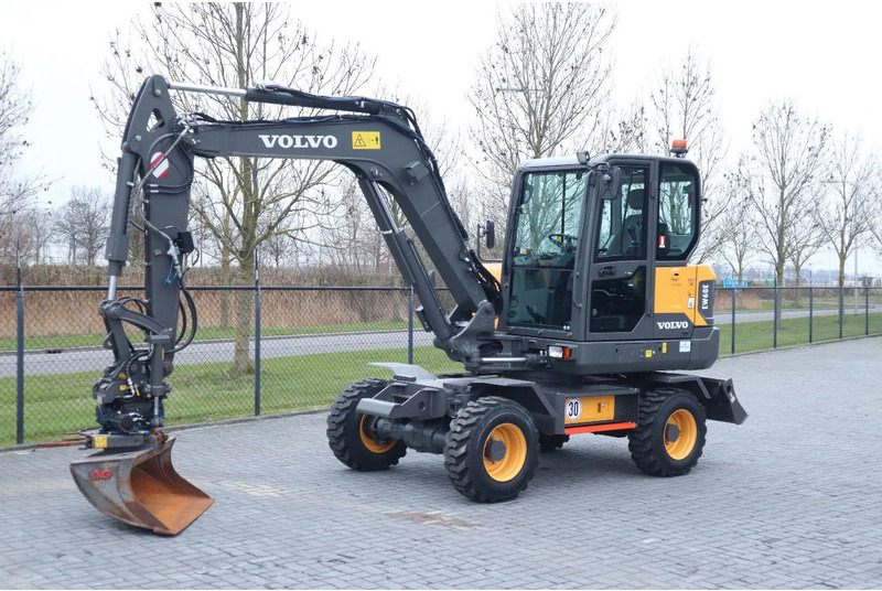 Volvo EW60E | DEMO | 30 KM/H | ROTOTILT + GRIPPER | BUCKET - Τροχοφόρος εκσκαφέας: φωτογραφία 2 Volvo EW60E | DEMO | 30 KM/H | ROTOTILT + GRIPPER | BUCKET - Τροχοφόρος εκσκαφέας: φωτογραφία 2
