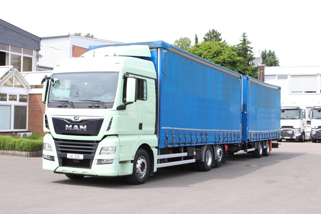 MAN TGX 26.460 Retarder Jumbo-Zug 120M3 Durchlade - Φορτηγό μουσαμάς: φωτογραφία 1 MAN TGX 26.460 Retarder Jumbo-Zug 120M3 Durchlade - Φορτηγό μουσαμάς: φωτογραφία 1