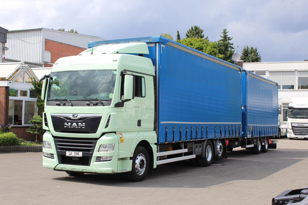 MAN TGX 26.460 Retarder Jumbo-Zug 120M3 Durchlade - Φορτηγό μουσαμάς: φωτογραφία 1 MAN TGX 26.460 Retarder Jumbo-Zug 120M3 Durchlade - Φορτηγό μουσαμάς: φωτογραφία 1