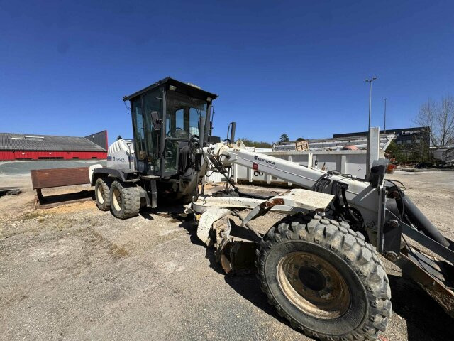 New Holland F106.6A alrrad 6x6 Grader 12 Ton - 10.700 Std - Γκρέιντερ: φωτογραφία 1 New Holland F106.6A alrrad 6x6 Grader 12 Ton - 10.700 Std - Γκρέιντερ: φωτογραφία 1