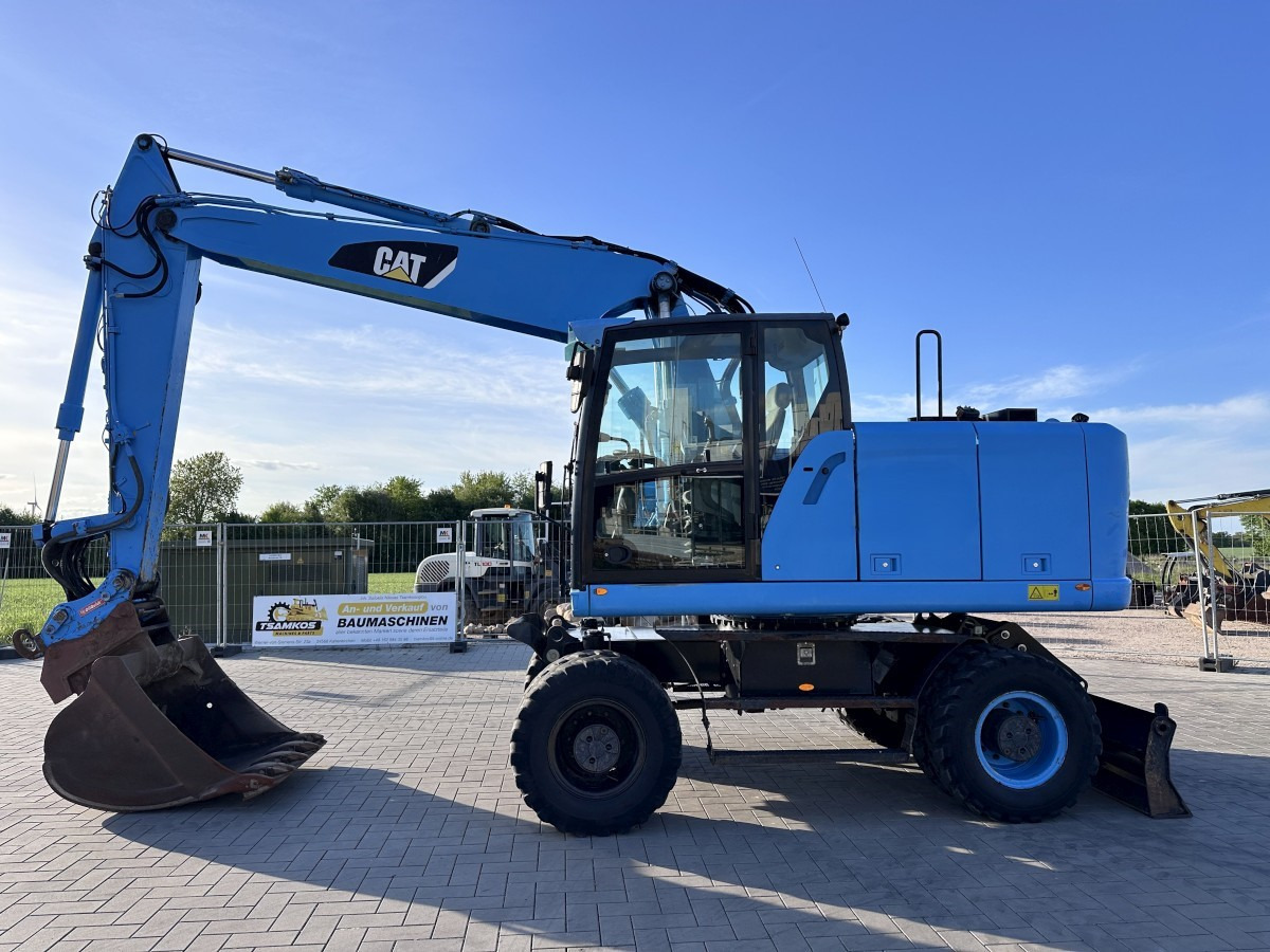 CATERPILLAR M 318 F Oil Quick OQ 65 Deutsche Maschine Top ! - Τροχοφόρος εκσκαφέας: φωτογραφία 1 CATERPILLAR M 318 F Oil Quick OQ 65 Deutsche Maschine Top ! - Τροχοφόρος εκσκαφέας: φωτογραφία 1