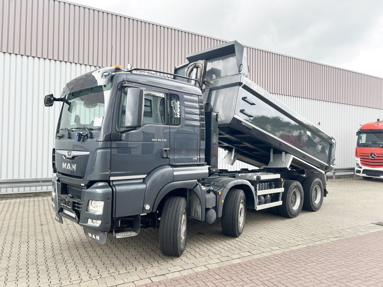 MAN TGS 35.510 8x4 BL TGS 35.510 8x4 BL, Intarder, Stahlmulde ca. 13m³, hydr. Heckklappenöffnung - Ανατρεπόμενο όχημα: φωτογραφία 1 MAN TGS 35.510 8x4 BL TGS 35.510 8x4 BL, Intarder, Stahlmulde ca. 13m³, hydr. Heckklappenöffnung - Ανατρεπόμενο όχημα: φωτογραφία 1
