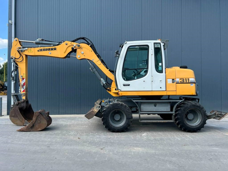 Liebherr A311 Litronic - Τροχοφόρος εκσκαφέας: φωτογραφία 5 Liebherr A311 Litronic - Τροχοφόρος εκσκαφέας: φωτογραφία 5