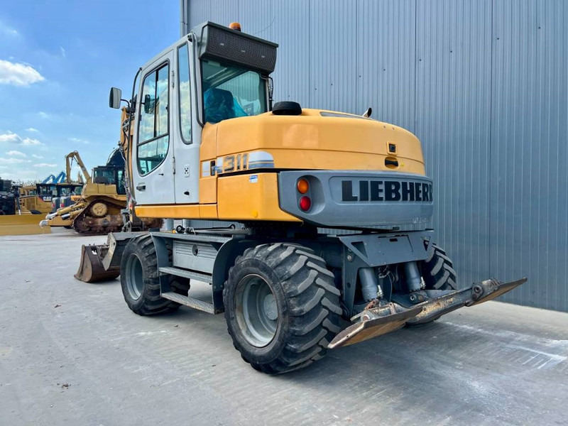 Liebherr A311 Litronic - Τροχοφόρος εκσκαφέας: φωτογραφία 2 Liebherr A311 Litronic - Τροχοφόρος εκσκαφέας: φωτογραφία 2