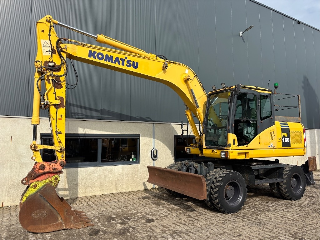 Komatsu PW 160-7 - PW160 - PW 160 - PW 180 - PW 140 - Τροχοφόρος εκσκαφέας: φωτογραφία 1 Komatsu PW 160-7 - PW160 - PW 160 - PW 180 - PW 140 - Τροχοφόρος εκσκαφέας: φωτογραφία 1