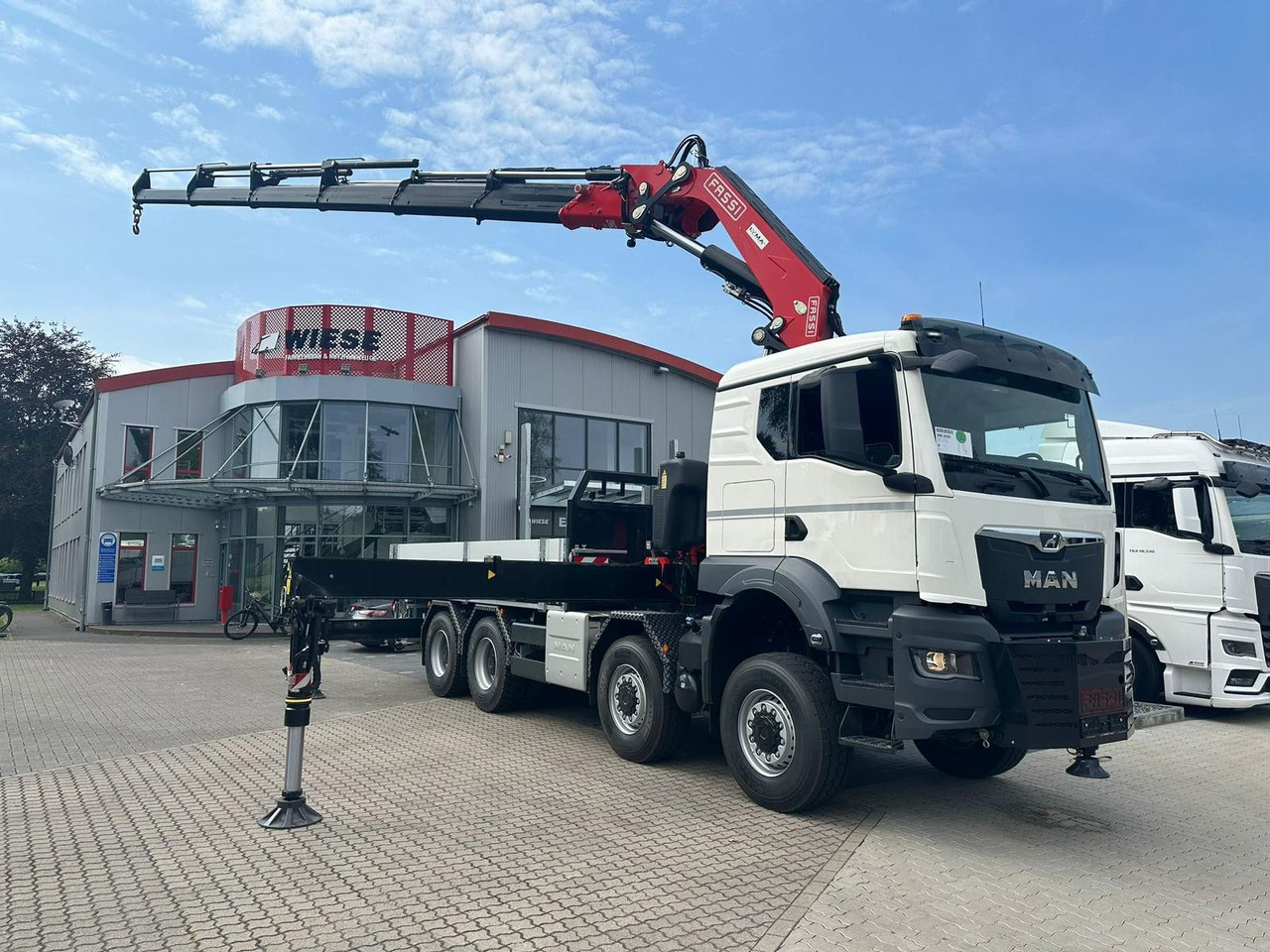 MAN TGS 41.520 8x8 mit Fassi Ladekran F710RA.2.26 - Φορτηγό με ανοιχτή καρότσα: φωτογραφία 1 MAN TGS 41.520 8x8 mit Fassi Ladekran F710RA.2.26 - Φορτηγό με ανοιχτή καρότσα: φωτογραφία 1