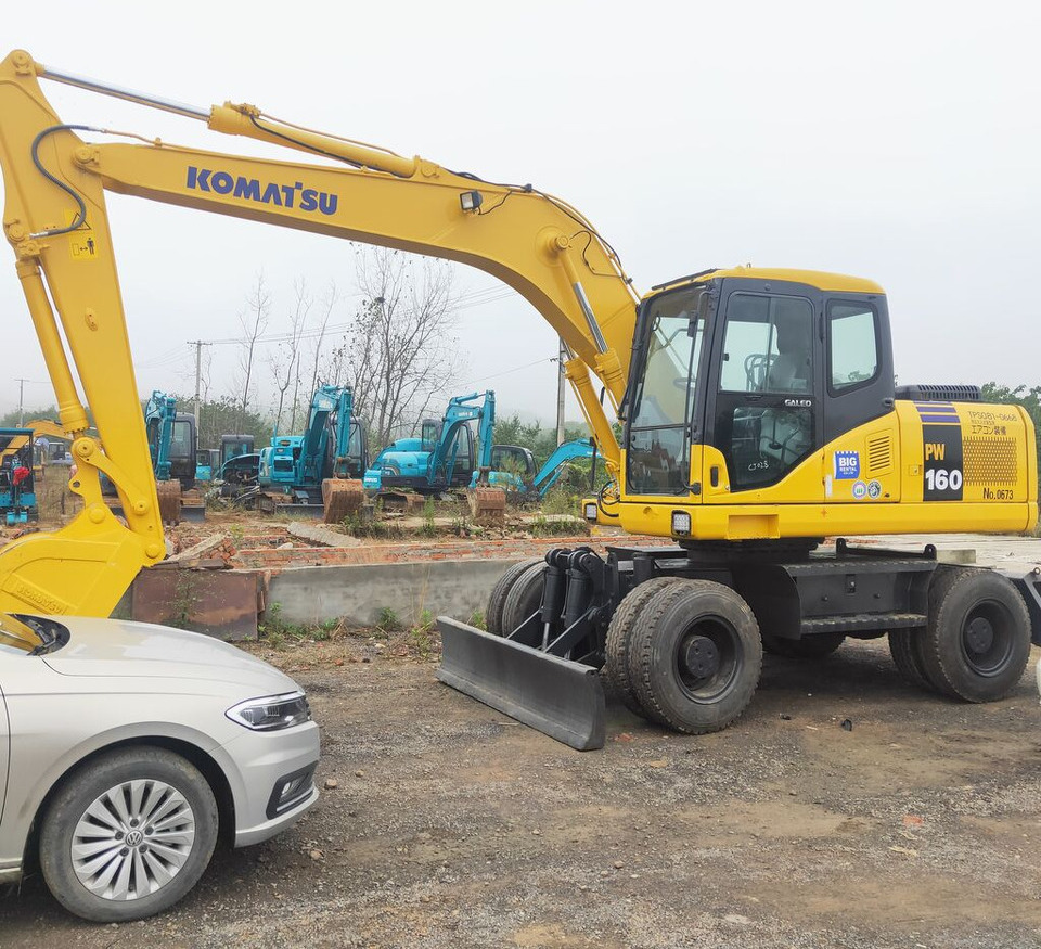 Komatsu PW160 - Τροχοφόρος εκσκαφέας: φωτογραφία 1 Komatsu PW160 - Τροχοφόρος εκσκαφέας: φωτογραφία 1