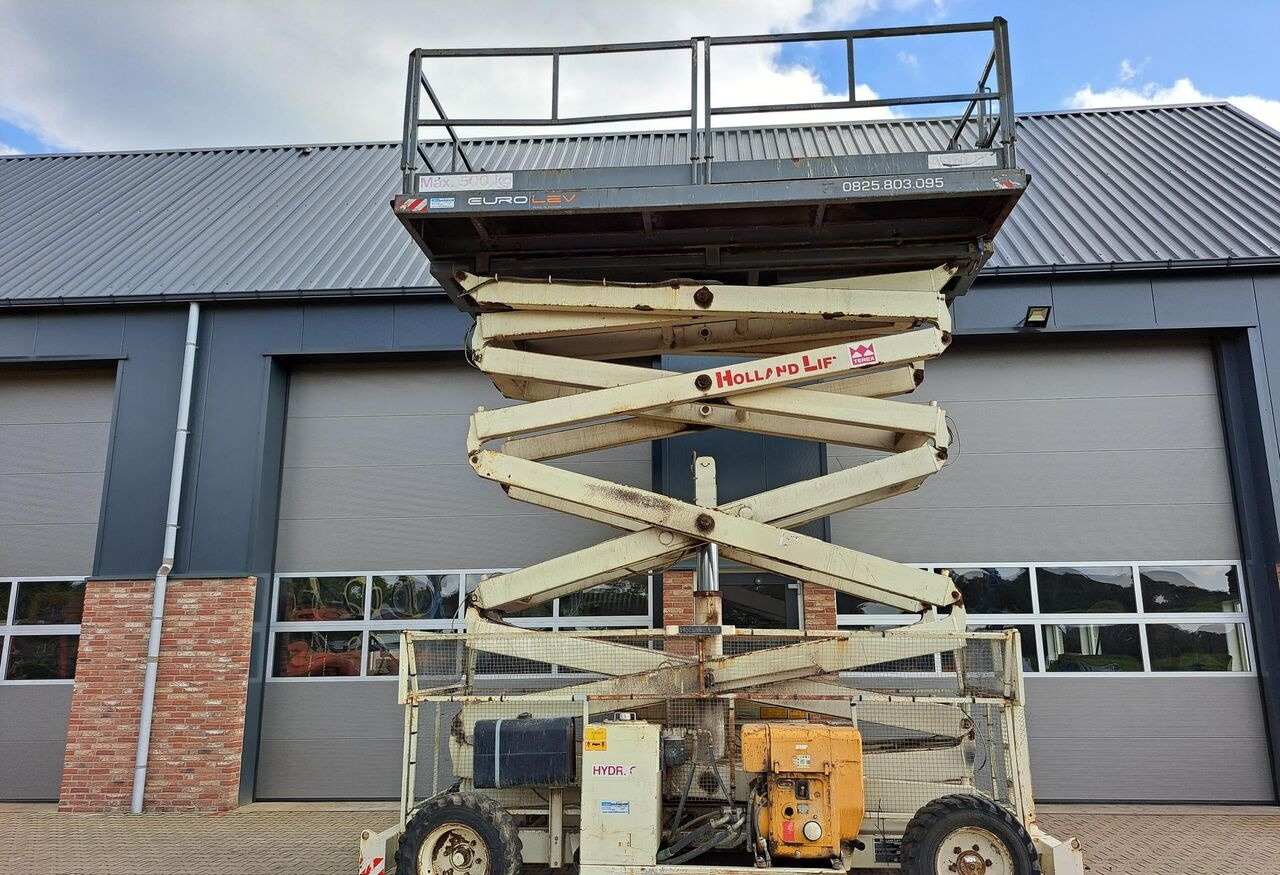 Holland Lift A151DV - Ψαλιδωτό ανυψωτικό: φωτογραφία 1 Holland Lift A151DV - Ψαλιδωτό ανυψωτικό: φωτογραφία 1