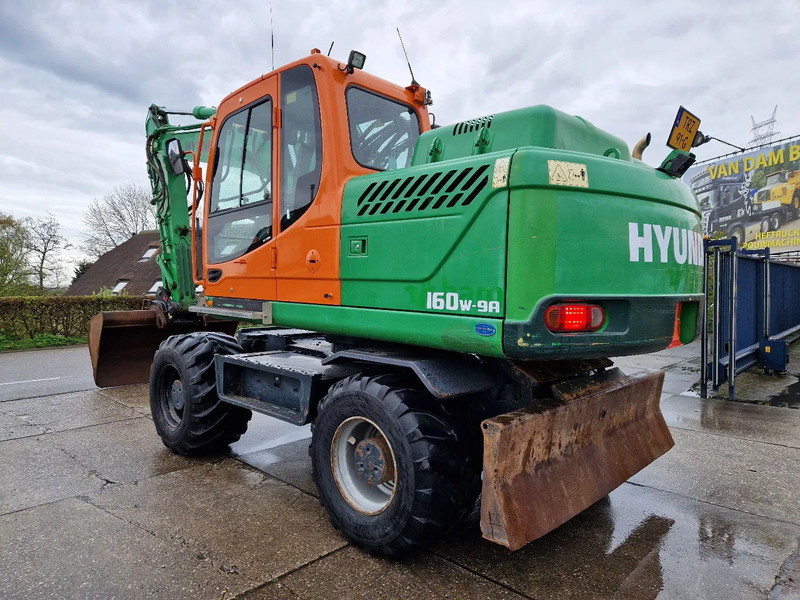 Hyundai Robex 160W-9A met 6-cilinder Cummins motor - Τροχοφόρος εκσκαφέας: φωτογραφία 1 Hyundai Robex 160W-9A met 6-cilinder Cummins motor - Τροχοφόρος εκσκαφέας: φωτογραφία 1