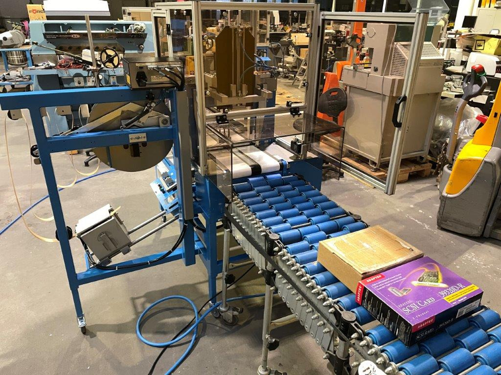 ATS Tanner UltraSonic US 2000-AB transit banding machine with pneumatic product hold-down and infeed roller table - Μηχανή συσκευασίας: φωτογραφία 1 ATS Tanner UltraSonic US 2000-AB transit banding machine with pneumatic product hold-down and infeed roller table - Μηχανή συσκευασίας: φωτογραφία 1