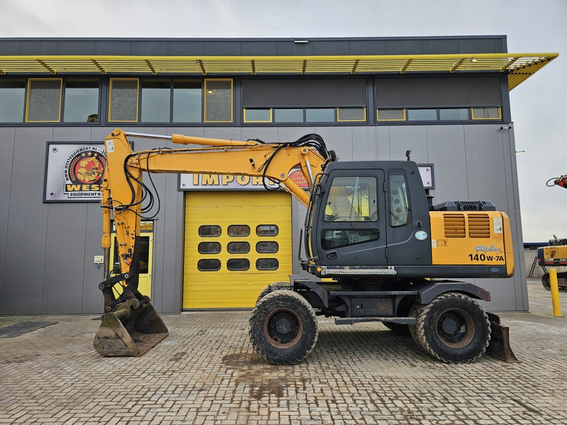 Hyundai R140W-7A - Τροχοφόρος εκσκαφέας: φωτογραφία 1 Hyundai R140W-7A - Τροχοφόρος εκσκαφέας: φωτογραφία 1