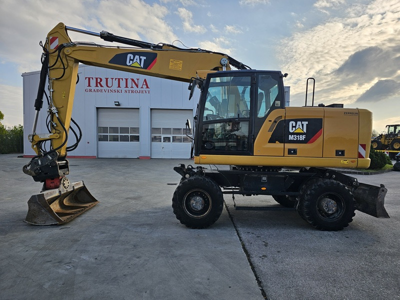 CATERPILLAR M318F - Τροχοφόρος εκσκαφέας: φωτογραφία 1 CATERPILLAR M318F - Τροχοφόρος εκσκαφέας: φωτογραφία 1
