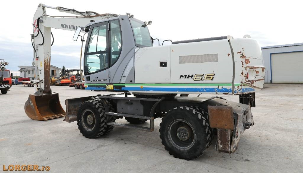 New Holland MH 6.6 + Sandvic Hammer - Τροχοφόρος εκσκαφέας: φωτογραφία 3 New Holland MH 6.6 + Sandvic Hammer - Τροχοφόρος εκσκαφέας: φωτογραφία 3