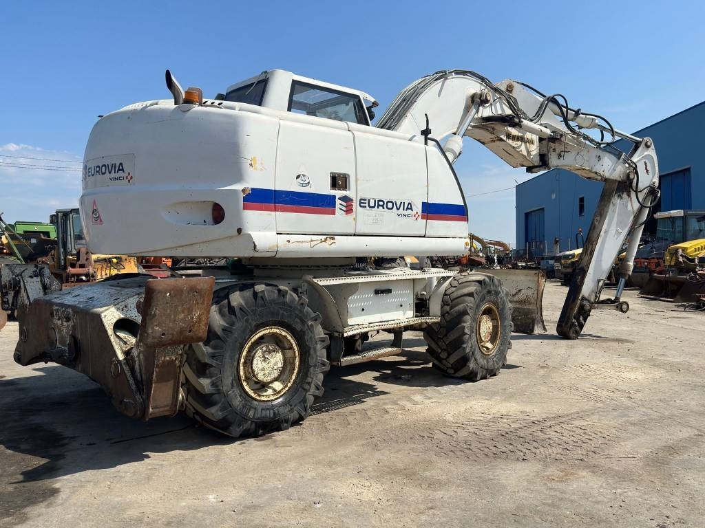 New Holland MH Plus - Τροχοφόρος εκσκαφέας: φωτογραφία 4 New Holland MH Plus - Τροχοφόρος εκσκαφέας: φωτογραφία 4