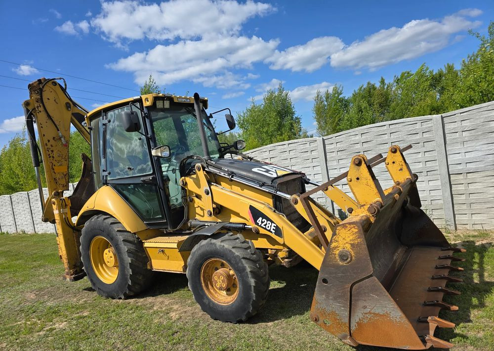 Caterpillar - Φορτωτής εκσκαφέας: φωτογραφία 1 Caterpillar - Φορτωτής εκσκαφέας: φωτογραφία 1