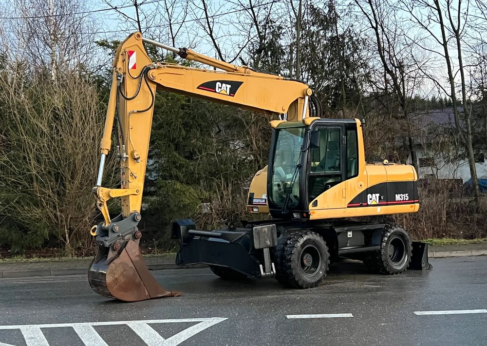 Caterpillar CAT M315C CATERPILLAR SPROWADZONY Bardzo Dobry Stan - Τροχοφόρος εκσκαφέας: φωτογραφία 1 Caterpillar CAT M315C CATERPILLAR SPROWADZONY Bardzo Dobry Stan - Τροχοφόρος εκσκαφέας: φωτογραφία 1