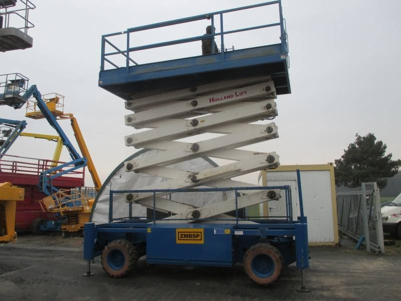 Holland Lift B 195 DL 25 - Ψαλιδωτό ανυψωτικό: φωτογραφία 1 Holland Lift B 195 DL 25 - Ψαλιδωτό ανυψωτικό: φωτογραφία 1