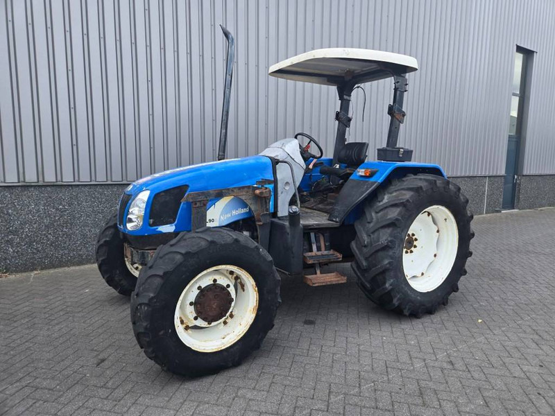 New Holland TL 90 A - Τρακτέρ: φωτογραφία 1 New Holland TL 90 A - Τρακτέρ: φωτογραφία 1