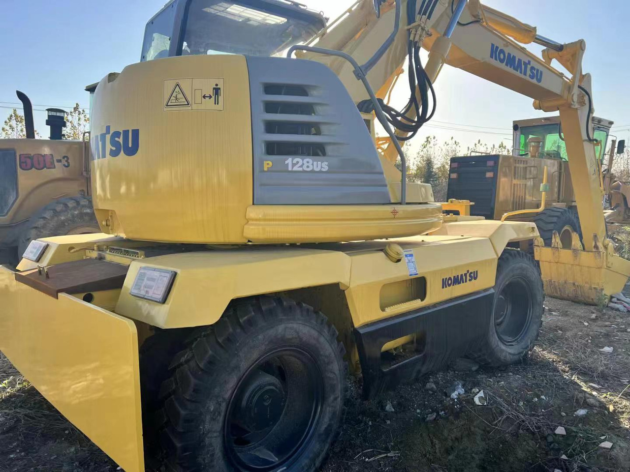 KOMATSU PC128US - Τροχοφόρος εκσκαφέας: φωτογραφία 2 KOMATSU PC128US - Τροχοφόρος εκσκαφέας: φωτογραφία 2