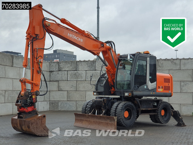 Hitachi ZX140W -3 OUTRIGGERS - ROTOTILT - Τροχοφόρος εκσκαφέας: φωτογραφία 1 Hitachi ZX140W -3 OUTRIGGERS - ROTOTILT - Τροχοφόρος εκσκαφέας: φωτογραφία 1