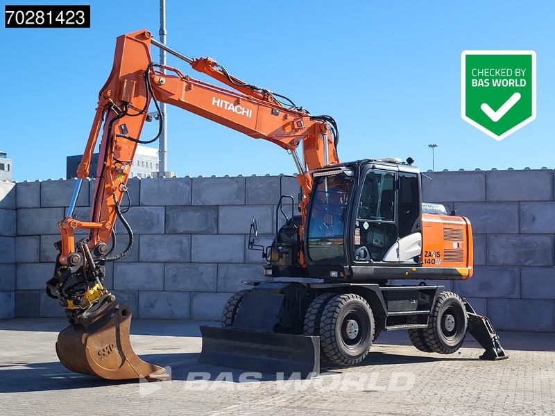 Hitachi ZX140W -5 OUTRIGGERS + BLADE - Τροχοφόρος εκσκαφέας: φωτογραφία 1 Hitachi ZX140W -5 OUTRIGGERS + BLADE - Τροχοφόρος εκσκαφέας: φωτογραφία 1