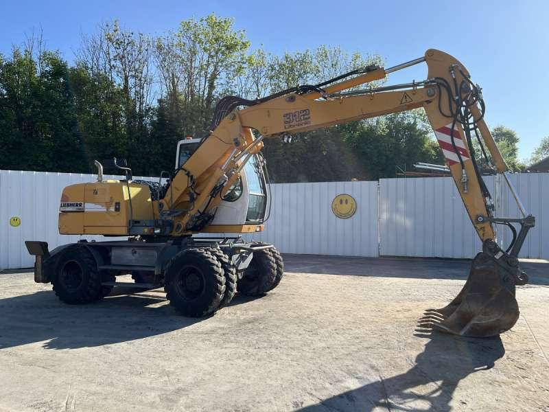 Liebherr A312 Litronic - Τροχοφόρος εκσκαφέας: φωτογραφία 1 Liebherr A312 Litronic - Τροχοφόρος εκσκαφέας: φωτογραφία 1