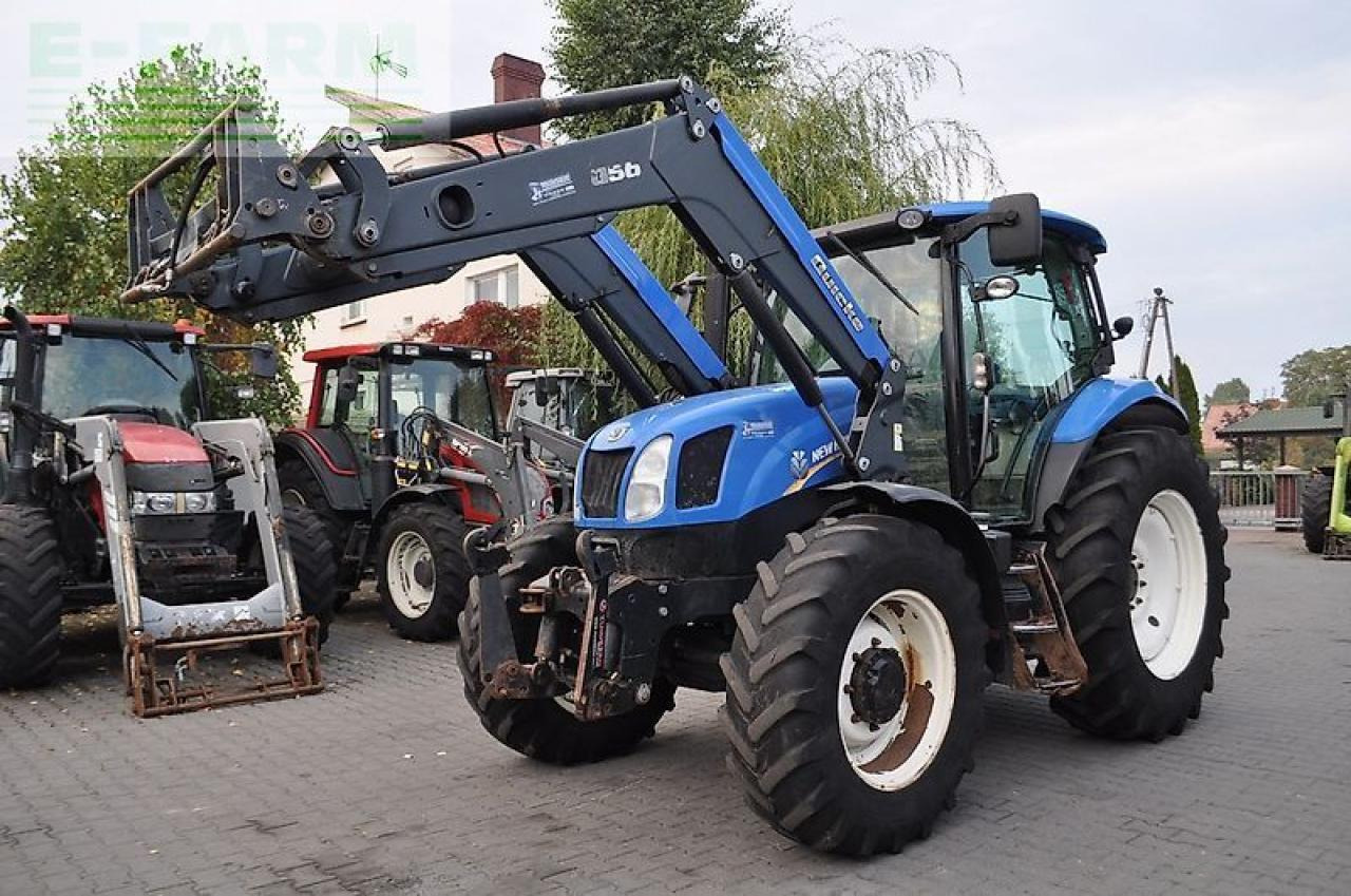 New Holland t6.140 + quicke q56 - Τρακτέρ: φωτογραφία 1 New Holland t6.140 + quicke q56 - Τρακτέρ: φωτογραφία 1