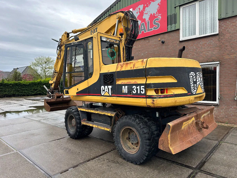 Caterpillar M315 +ROTO CE - Τροχοφόρος εκσκαφέας: φωτογραφία 4 Caterpillar M315 +ROTO CE - Τροχοφόρος εκσκαφέας: φωτογραφία 4
