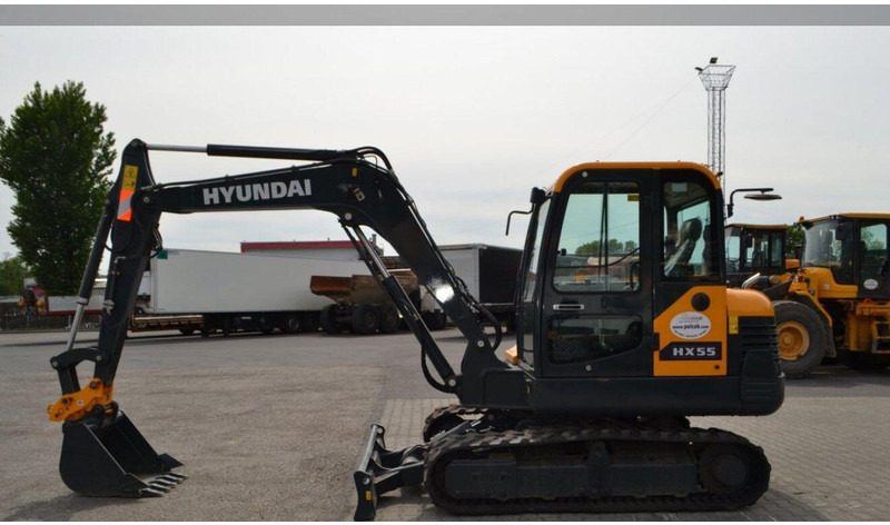 Hyundai HX55 Mini lánctalpas forgókotró - Μίνι εκσκαφέας: φωτογραφία 5 Hyundai HX55 Mini lánctalpas forgókotró - Μίνι εκσκαφέας: φωτογραφία 5