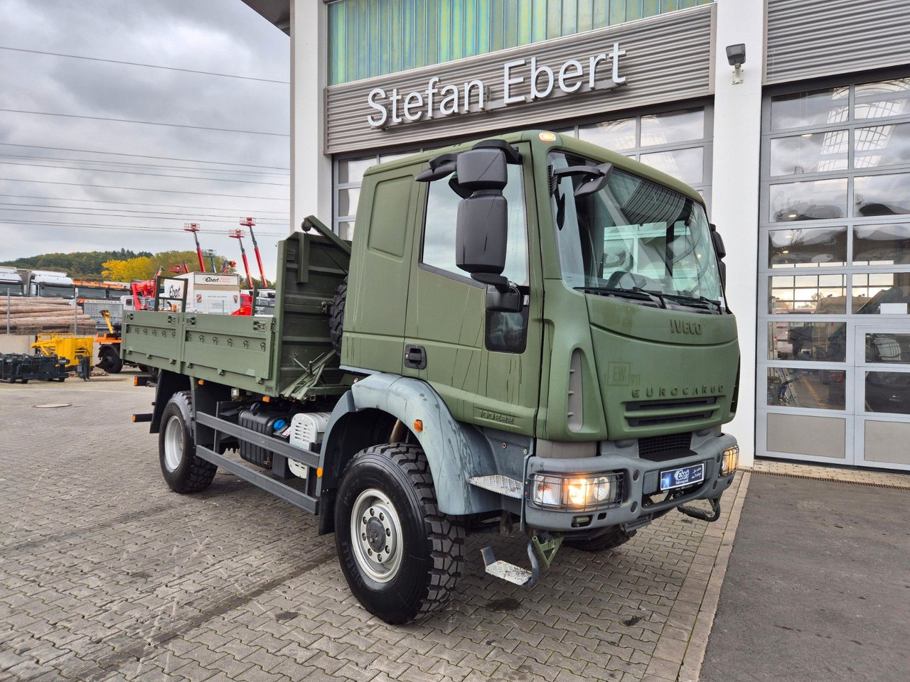 Iveco Eurocargo ML100E22WM-BW 4x4 Pritsche L-Haus Bett - Φορτηγό με ανοιχτή καρότσα: φωτογραφία 2 Iveco Eurocargo ML100E22WM-BW 4x4 Pritsche L-Haus Bett - Φορτηγό με ανοιχτή καρότσα: φωτογραφία 2